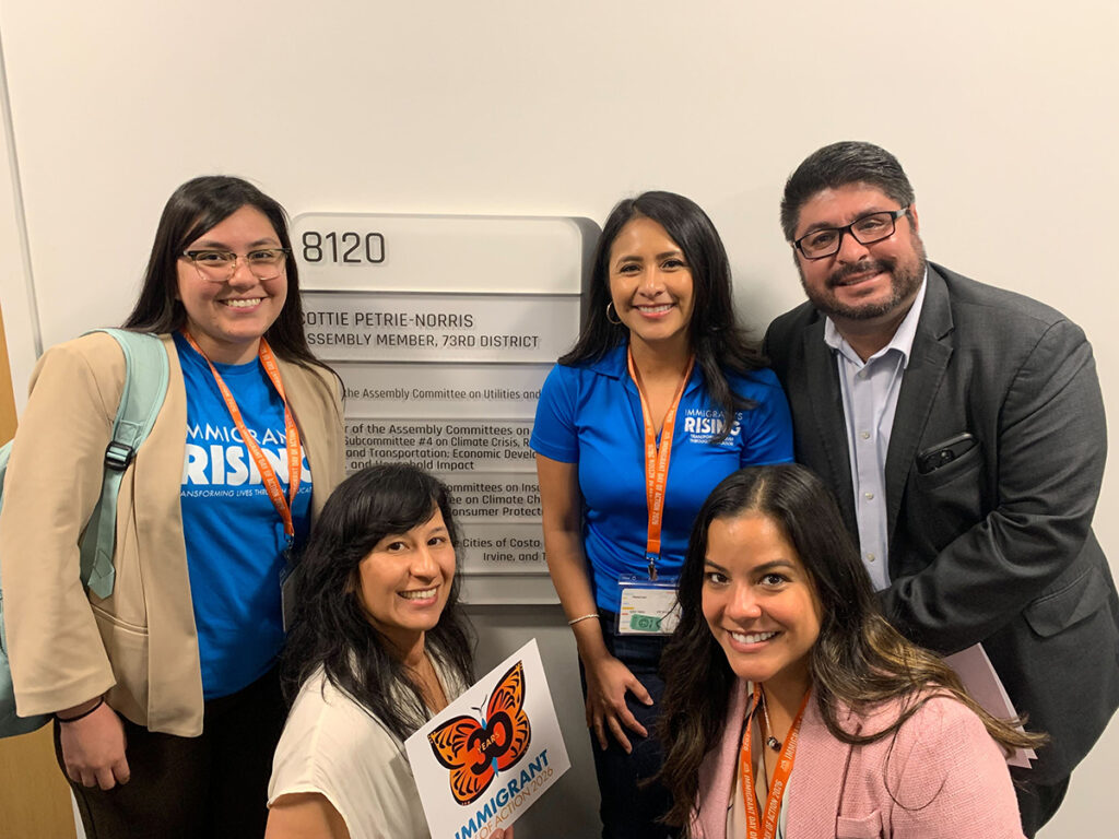Immigrants Rising team (Daniela R., Alejandra G., Iliana P., Pedro R.) and Dr. Marlene Orozco in front of Assemblymember Cottie Petrie-Norris’s office during Advocacy Day