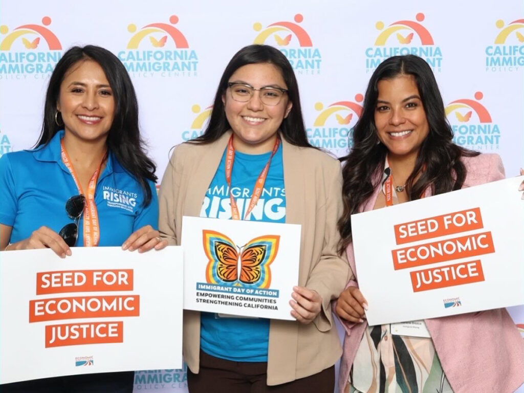Iliana P., Daniela R., and Dr. Marlene Orozco pose at a photobooth to celebrate CIPC’s 30 years and a galvanizing Immigrant Day of Action