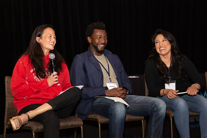 Kathy (left) on stage with Edem (middle) and Liliana (right) during 2019 Catalyst Fund Convening.
