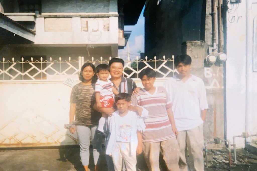 Photo of Hans (middle) and family, last picture taken in the Philippines before immigrating to the U.S.